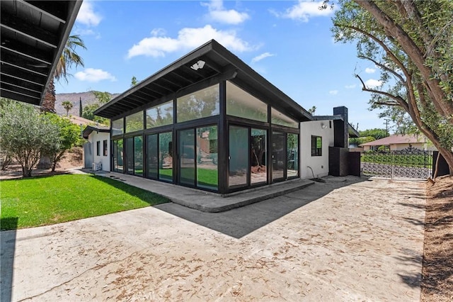 151 Barret Rd, Riverside, CA 92507 - back of house with a sunroom and a lawn