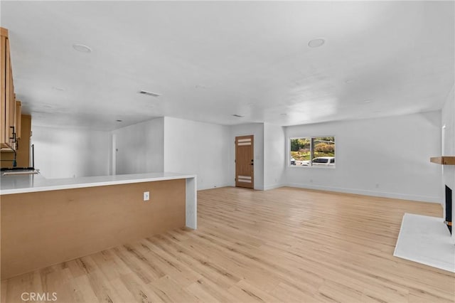 151 Barret Rd, Riverside, CA 92507 - unfurnished living room featuring light wood finished floors and a fireplace