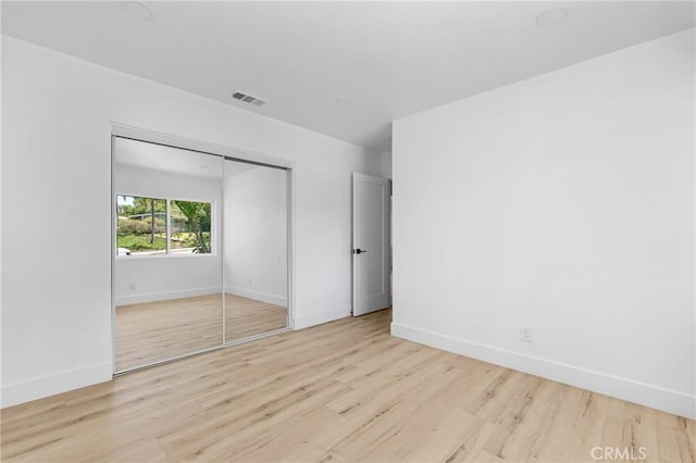 151 Barret Rd, Riverside, CA 92507 - unfurnished bedroom with wood finished floors and a closet