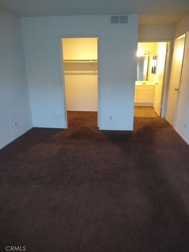 43731 8th St E, Lancaster, CA 93535 - unfurnished bedroom featuring a spacious closet, carpet flooring, a closet, and ensuite bathroom