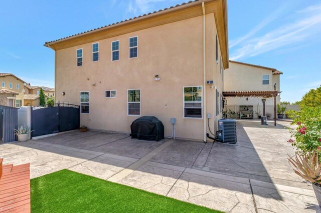 1349 Pyramid Peak St, Chula Vista, CA 91913 - back of property featuring a patio area, stucco siding, and a gate
