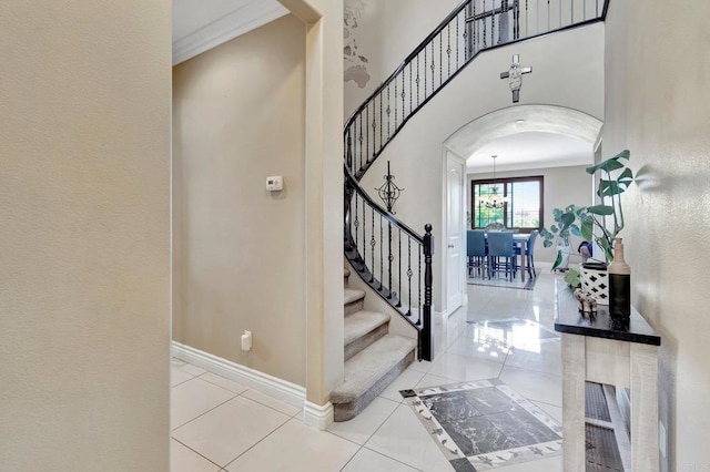 1349 Pyramid Peak St, Chula Vista, CA 91913 - entrance foyer featuring arched walkways, tile patterned floors, ornamental molding, and stairs