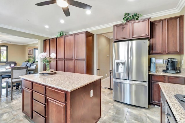 1349 Pyramid Peak St, Chula Vista, CA 91913 - kitchen with stainless steel fridge, a ceiling fan, a center island, recessed lighting, and light stone countertops