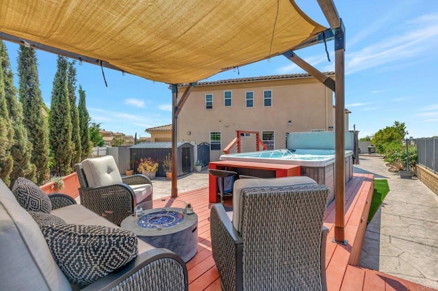 1349 Pyramid Peak St, Chula Vista, CA 91913 - wooden deck featuring a hot tub, a fire pit, a storage unit, and a fenced backyard