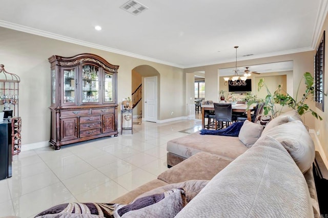 1349 Pyramid Peak St, Chula Vista, CA 91913 - living area featuring arched walkways, light tile patterned floors, crown molding, and stairs