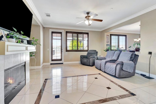 1349 Pyramid Peak St, Chula Vista, CA 91913 - living area featuring inlaid floor details, a fireplace, a ceiling fan, ornamental molding, and a chandelier