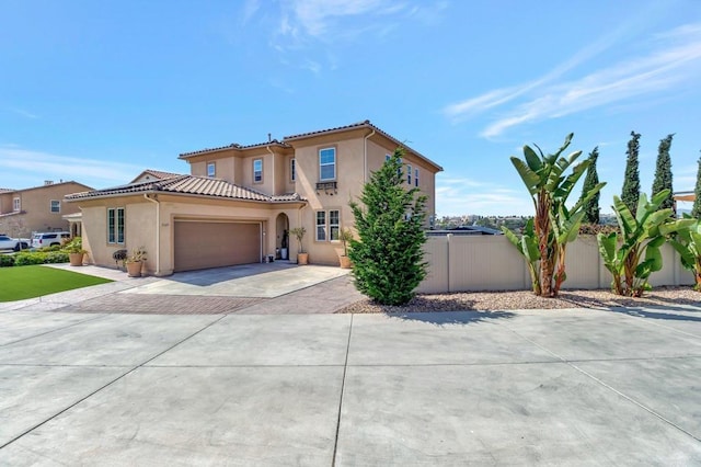1349 Pyramid Peak St, Chula Vista, CA 91913 - mediterranean / spanish-style house with stucco siding, an attached garage, decorative driveway, and a tile roof