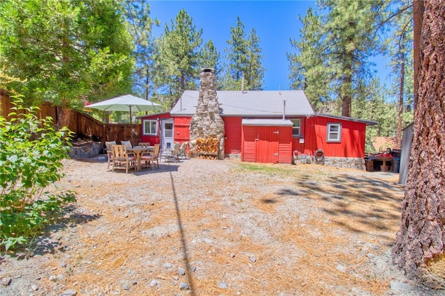 1815 Thrush Rd, Wrightwood, CA 92397 - rear view of house with a shed, a chimney, and a patio