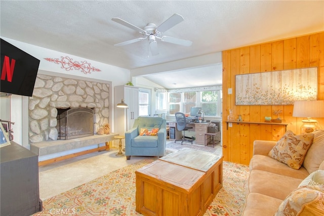 1815 Thrush Rd, Wrightwood, CA 92397 - living room featuring ceiling fan, a stone fireplace, carpet, a textured ceiling, and a desk