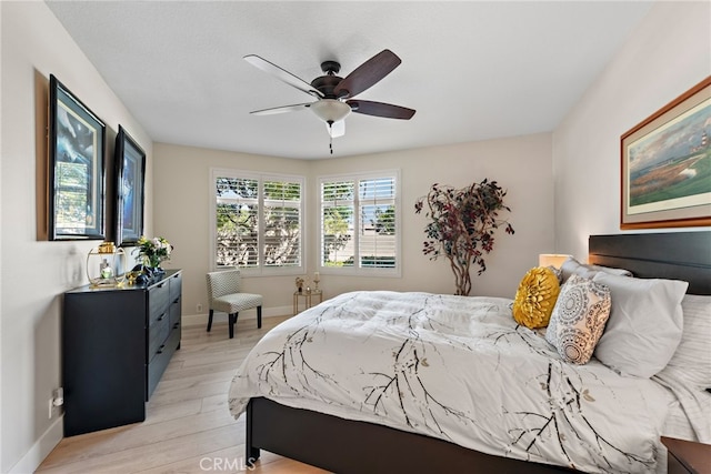 29 Baycrest Ct Unit 16, Newport Beach, CA 92660 - bedroom with light wood-style floors and a ceiling fan