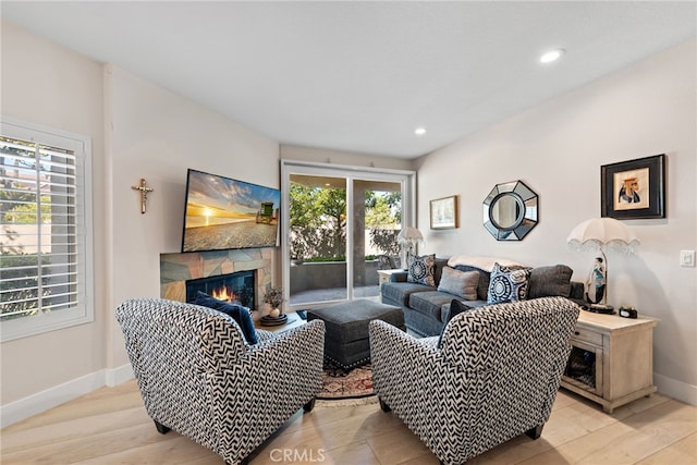 29 Baycrest Ct Unit 16, Newport Beach, CA 92660 - living room with a glass covered fireplace, recessed lighting, and light wood-style floors