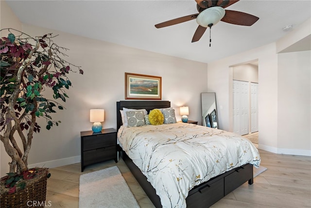 29 Baycrest Ct Unit 16, Newport Beach, CA 92660 - bedroom featuring wood finished floors, a closet, and ceiling fan