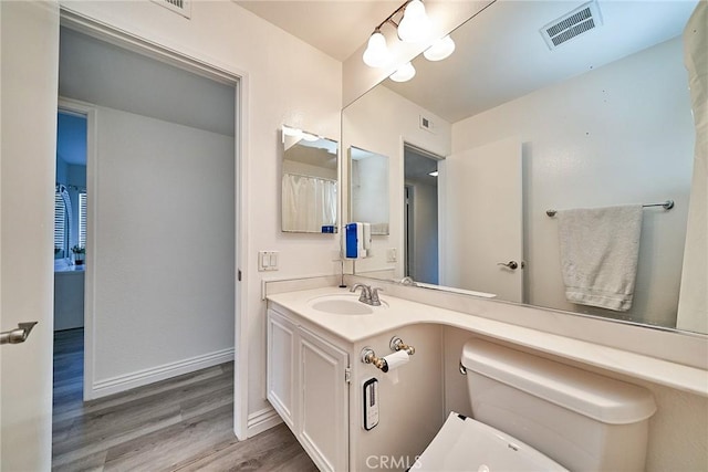 16011 Sugarpine Ln, Cerritos, CA 90703 - bathroom with wood finished floors and vanity