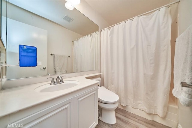 16011 Sugarpine Ln, Cerritos, CA 90703 - bathroom featuring wood finished floors, vanity, and shower / tub combo with curtain