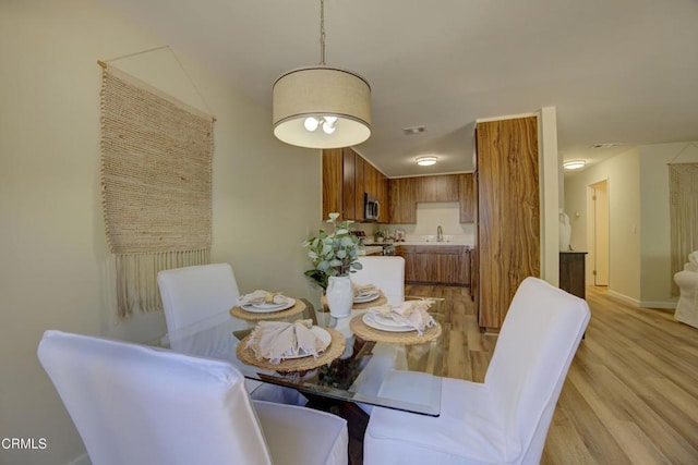 644 Orwell Ln, Ventura, CA 93003 - dining room with light wood-style flooring and baseboards