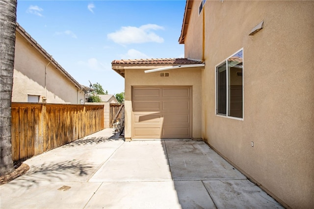 31257 Casera Ct, Menifee, CA 92584 - view of patio featuring concrete driveway and an attached garage