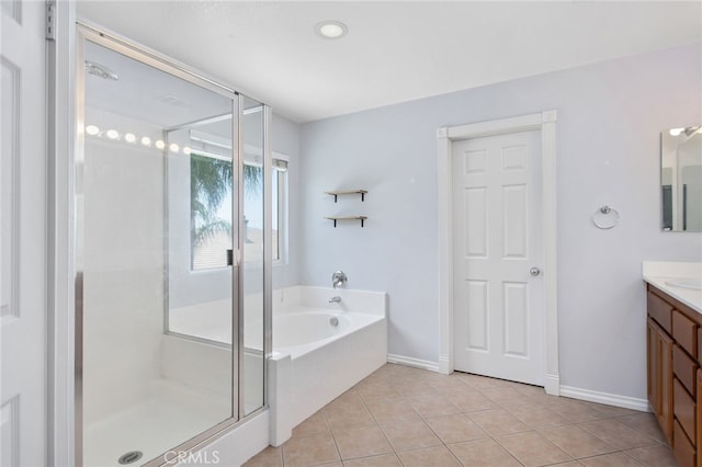 31257 Casera Ct, Menifee, CA 92584 - bathroom with vanity, a shower stall, a garden tub, and tile patterned flooring
