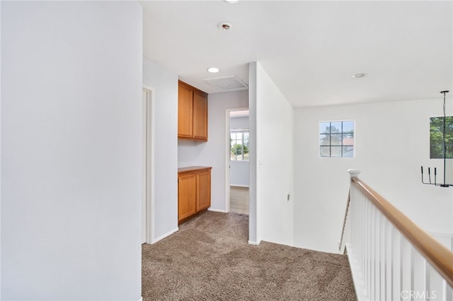 31257 Casera Ct, Menifee, CA 92584 - hallway with light colored carpet, an upstairs landing, and recessed lighting