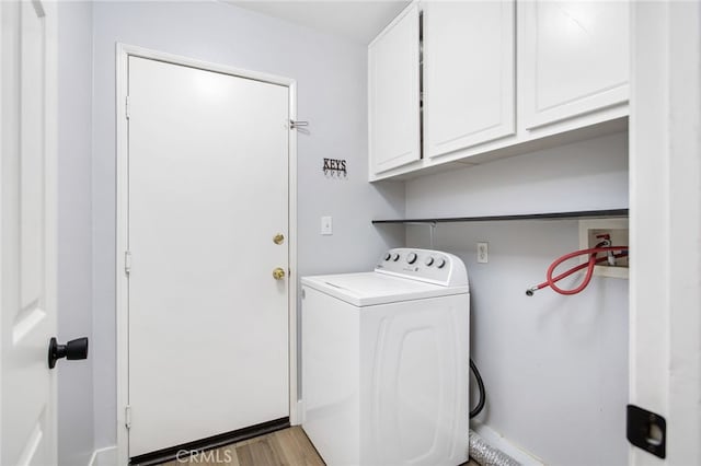 31257 Casera Ct, Menifee, CA 92584 - washroom with washer / dryer, cabinet space, and light wood-type flooring