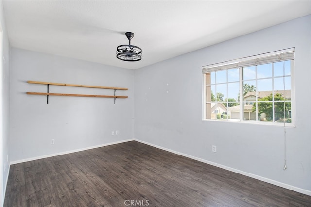 31257 Casera Ct, Menifee, CA 92584 - spare room featuring dark wood-style flooring and baseboards
