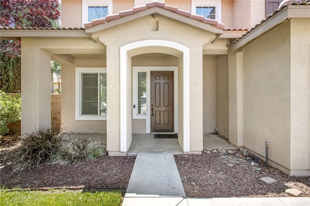 31257 Casera Ct, Menifee, CA 92584 - property entrance featuring stucco siding and a tiled roof