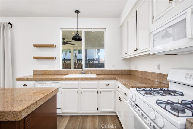 31257 Casera Ct, Menifee, CA 92584 - kitchen with white appliances, tile countertops, white cabinets, open shelves, and wood finished floors