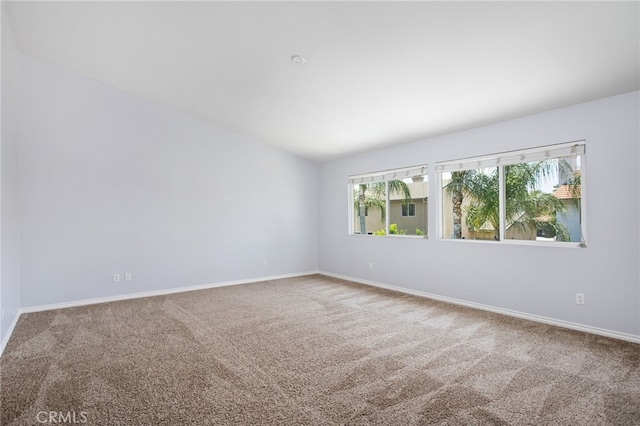 31257 Casera Ct, Menifee, CA 92584 - carpeted empty room featuring baseboards and lofted ceiling