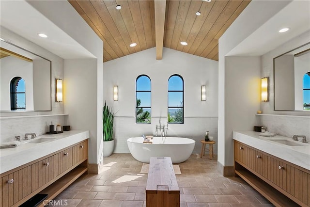 4 Thomas Rd, Ladera Ranch, CA 92694 - bathroom with a freestanding tub, two vanities, recessed lighting, and decorative backsplash