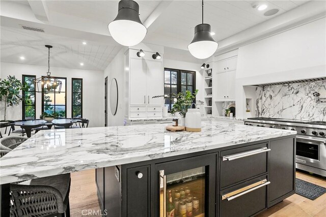 4 Thomas Rd, Ladera Ranch, CA 92694 - kitchen featuring dark cabinets, high end stainless steel range oven, white cabinetry, light wood-style flooring, and recessed lighting
