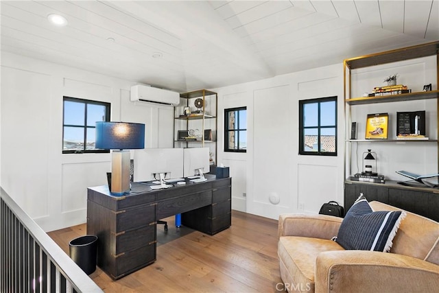 4 Thomas Rd, Ladera Ranch, CA 92694 - office space with a wall mounted air conditioner, wood finished floors, a decorative wall, and lofted ceiling
