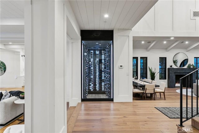 4 Thomas Rd, Ladera Ranch, CA 92694 - wine area with wood finished floors, recessed lighting, a fireplace, and wooden ceiling