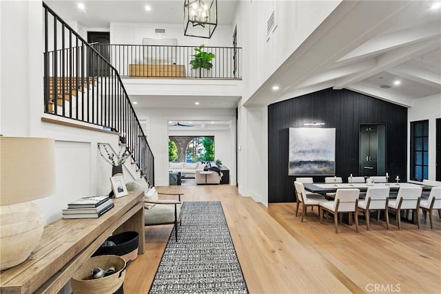4 Thomas Rd, Ladera Ranch, CA 92694 - entrance foyer featuring stairs, wood finished floors, a high ceiling, a chandelier, and beamed ceiling