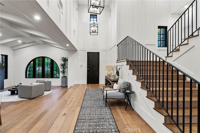 4 Thomas Rd, Ladera Ranch, CA 92694 - entrance foyer with healthy amount of natural light, hardwood / wood-style flooring, a high ceiling, stairs, and recessed lighting