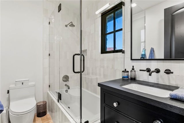 4 Thomas Rd, Ladera Ranch, CA 92694 - bathroom featuring shower / bath combination with glass door, vanity, and tile walls