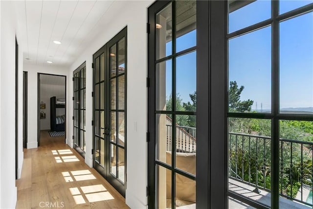 4 Thomas Rd, Ladera Ranch, CA 92694 - corridor with hardwood / wood-style flooring, recessed lighting, and french doors