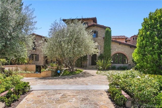 4 Thomas Rd, Ladera Ranch, CA 92694 - view of front of house with a tiled roof and driveway