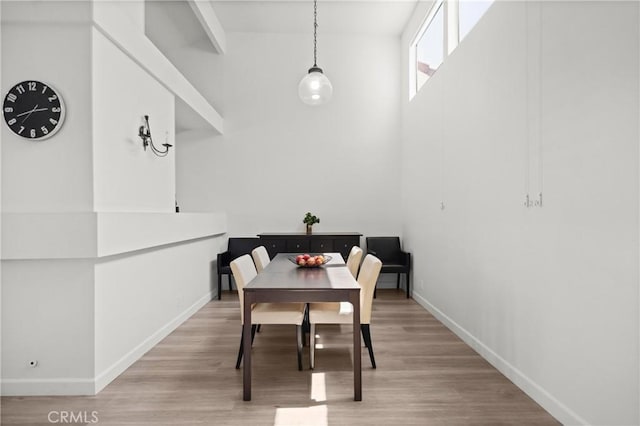 29 Morena Unit 35, Irvine, CA 92612 - dining space featuring wood finished floors and a high ceiling