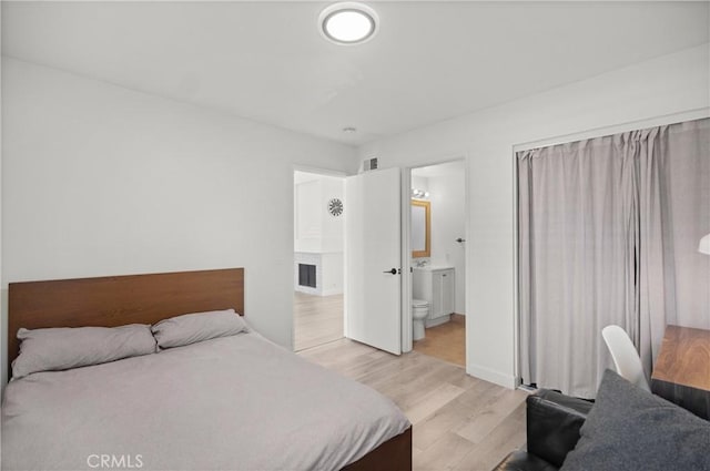 29 Morena Unit 35, Irvine, CA 92612 - bedroom featuring light wood-style floors and ensuite bathroom
