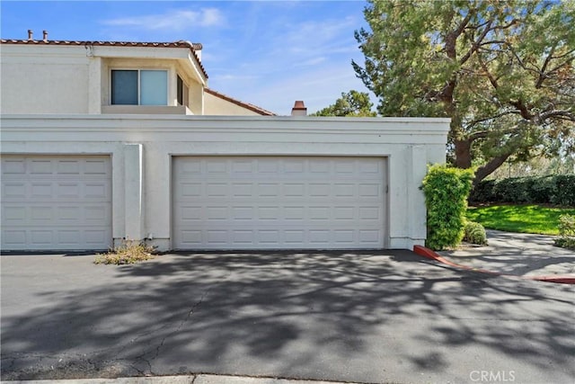 29 Morena Unit 35, Irvine, CA 92612 - garage featuring driveway