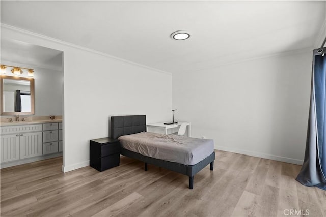 29 Morena Unit 35, Irvine, CA 92612 - bedroom with light wood finished floors, crown molding, and ensuite bathroom