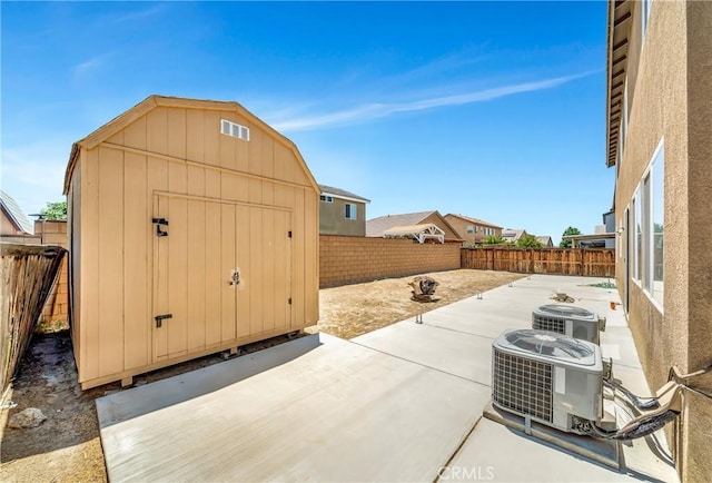 2354 Crimson Ave, Rosamond, CA 93560 - fenced backyard featuring a patio area and a storage unit