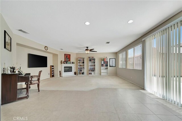 2354 Crimson Ave, Rosamond, CA 93560 - living area with a ceiling fan, light colored carpet, light tile patterned flooring, and recessed lighting