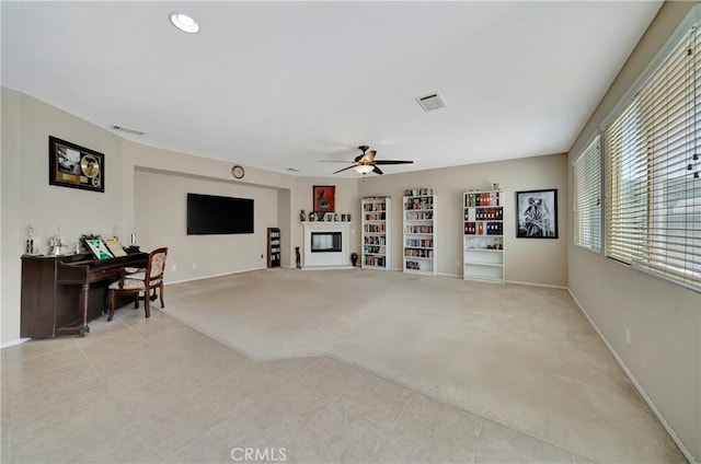 2354 Crimson Ave, Rosamond, CA 93560 - living room featuring light colored carpet, a ceiling fan, and light tile patterned flooring