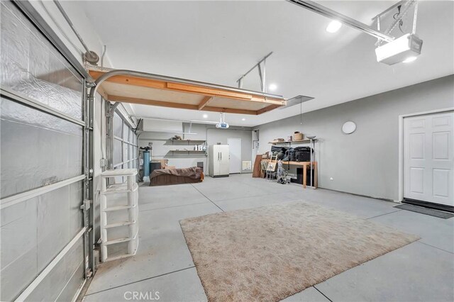 2354 Crimson Ave, Rosamond, CA 93560 - garage with freestanding refrigerator and a garage door opener