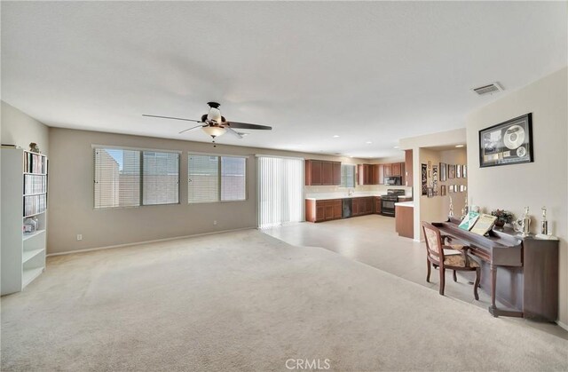 2354 Crimson Ave, Rosamond, CA 93560 - living room with healthy amount of natural light, ceiling fan, and light colored carpet