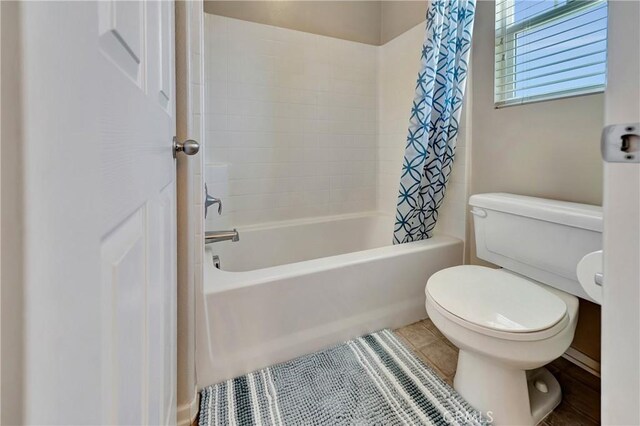 2354 Crimson Ave, Rosamond, CA 93560 - bathroom with shower / bath combination with curtain and tile patterned floors