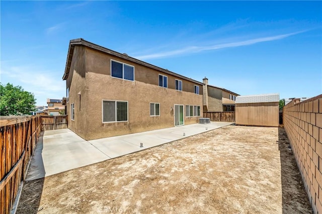2354 Crimson Ave, Rosamond, CA 93560 - rear view of property with a patio area, a storage unit, a fenced backyard, and stucco siding