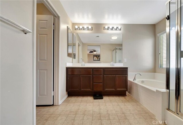 2354 Crimson Ave, Rosamond, CA 93560 - bathroom featuring a garden tub, double vanity, and a shower stall