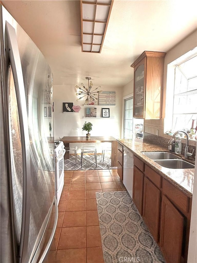 1836 Jaybrook Dr, Rancho Palos Verdes, CA 90275 - kitchen featuring white appliances, tile patterned flooring, brown cabinets, glass insert cabinets, and light stone countertops