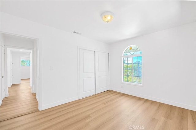 20328 Roscoe Blvd, Winnetka, CA 91306 - unfurnished bedroom with light wood finished floors and a closet